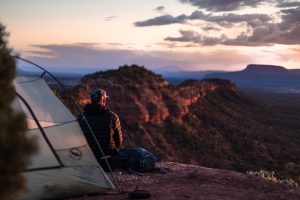 overnight camper looks at scenary