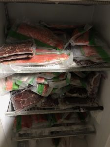 freezer full of vacuum sealed wild game