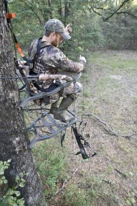 Bow hunting sitting on a seat cushion