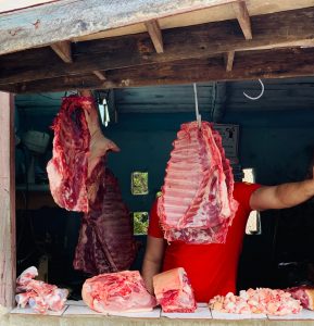 Hanging meat ready to be weighed with a scale