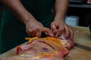 butcher processing meat