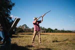 Shooter aiming shotgun