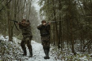 Two turkey hunters aiming